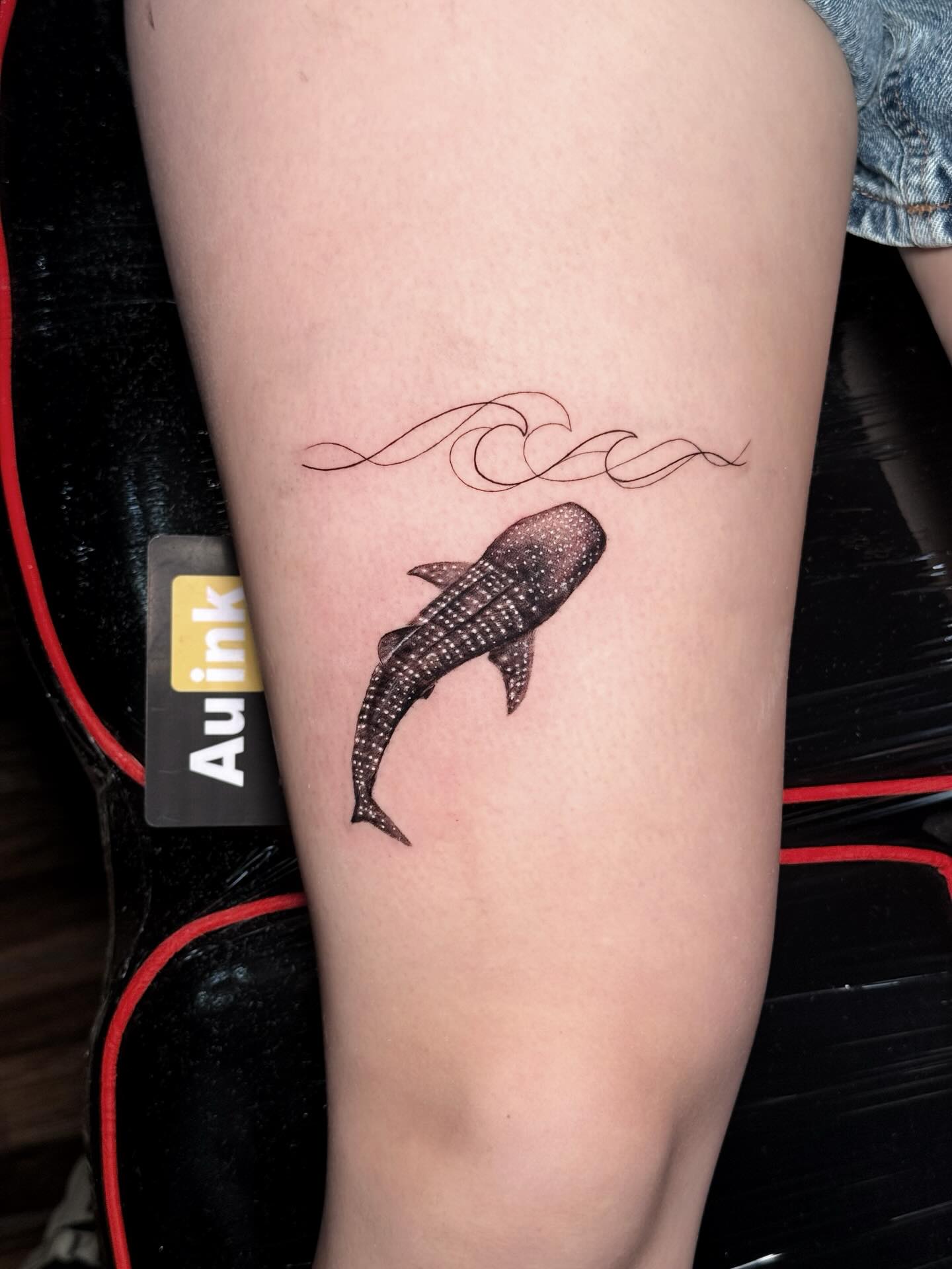 Whale shark and waves tattoo by Aurelio Dinorog III in Panglao