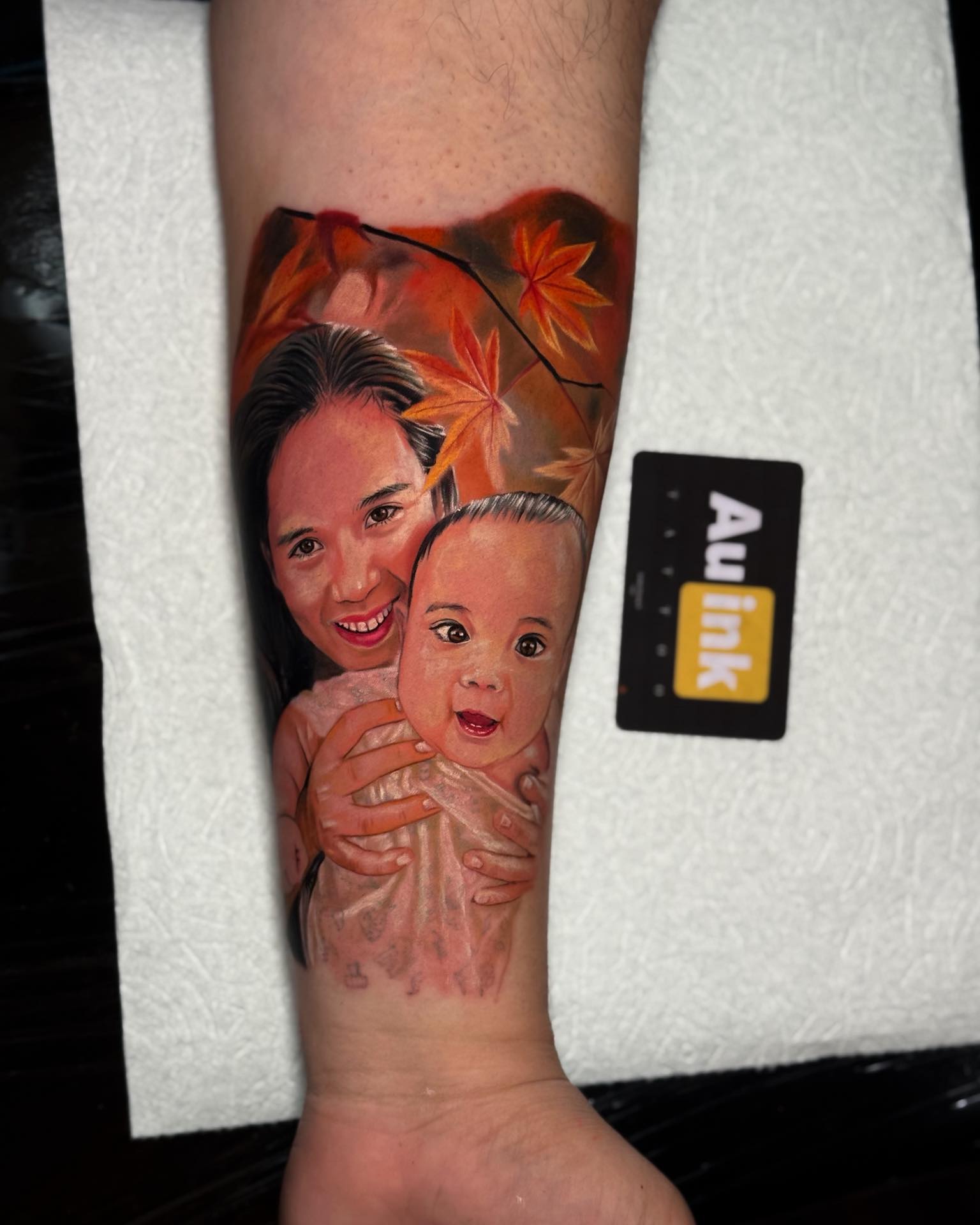 Mother and son portrait tattoo by Aurelio Dinorog III in Bohol