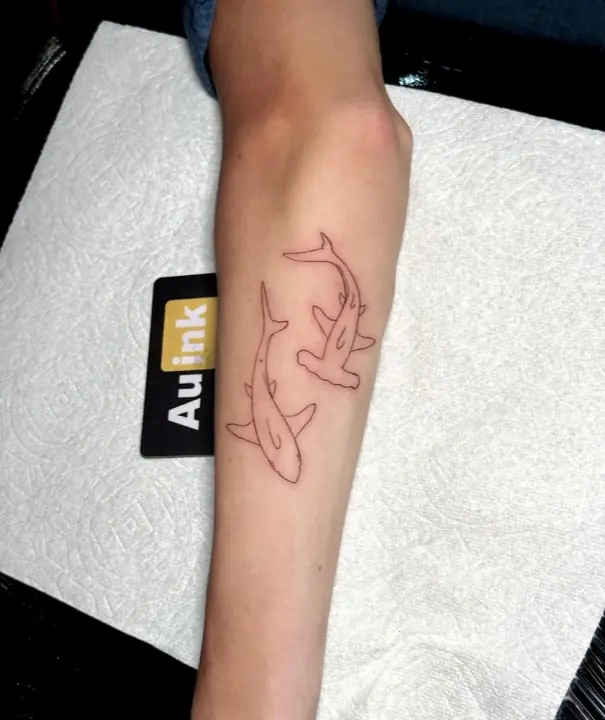 Sharks, island-inspired tattoo by Aurelio Dinorog III